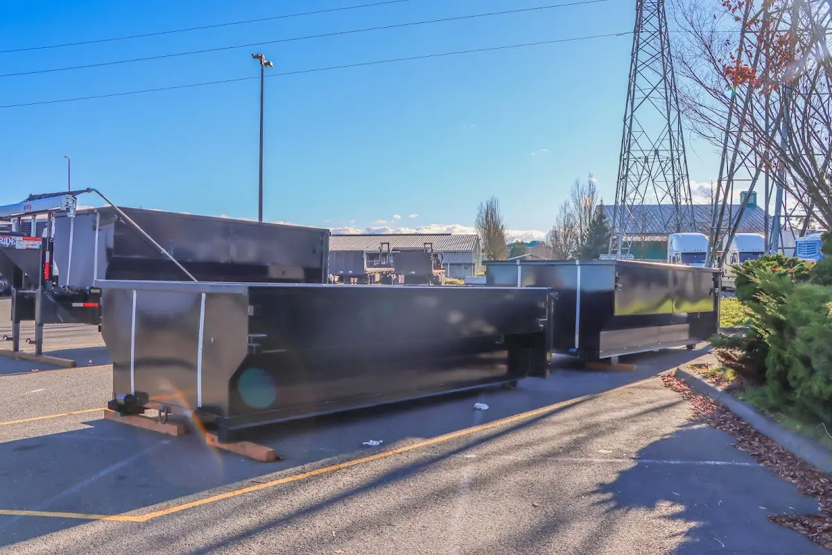 Roll-off dumpster ready for waste disposal at job site for 2 Yard Dumpster Rental in Lakewood